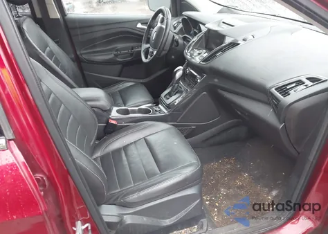 2014 Ford Escape Titanium z USA, uszkodzony, nr VIN 1FMCU0J96EUD93271